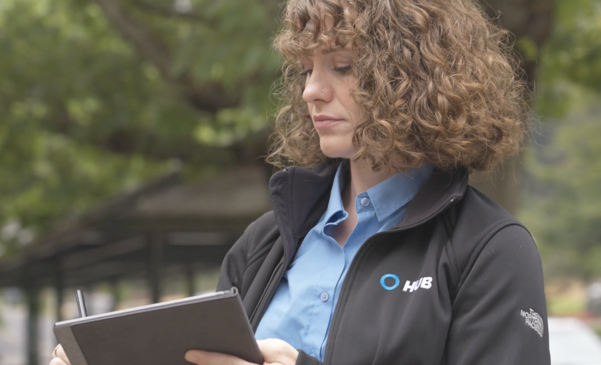 HUB Team Haugen team member working with tablet